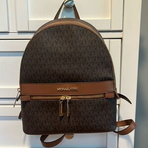 Michael Kors small backpack.